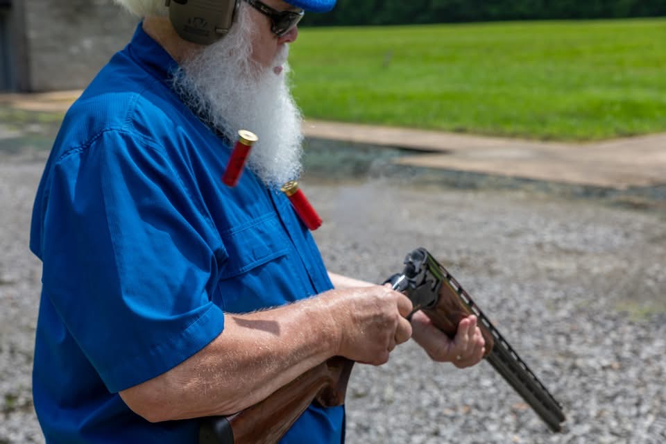 Bobby Jones handling a shotgun on set for the marksmanship commercial